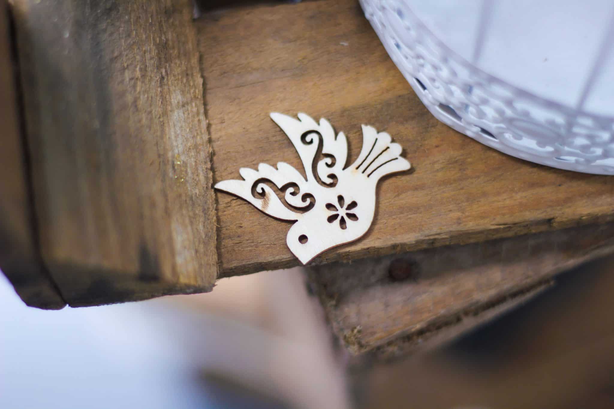 Dove cut out on wooden table