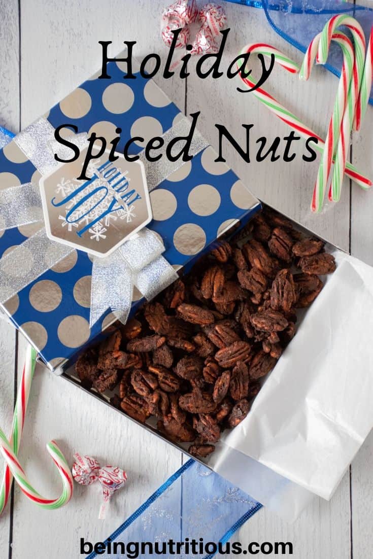 Gift box full of sugared spiced nuts. Text overlay: Holiday spiced nuts
