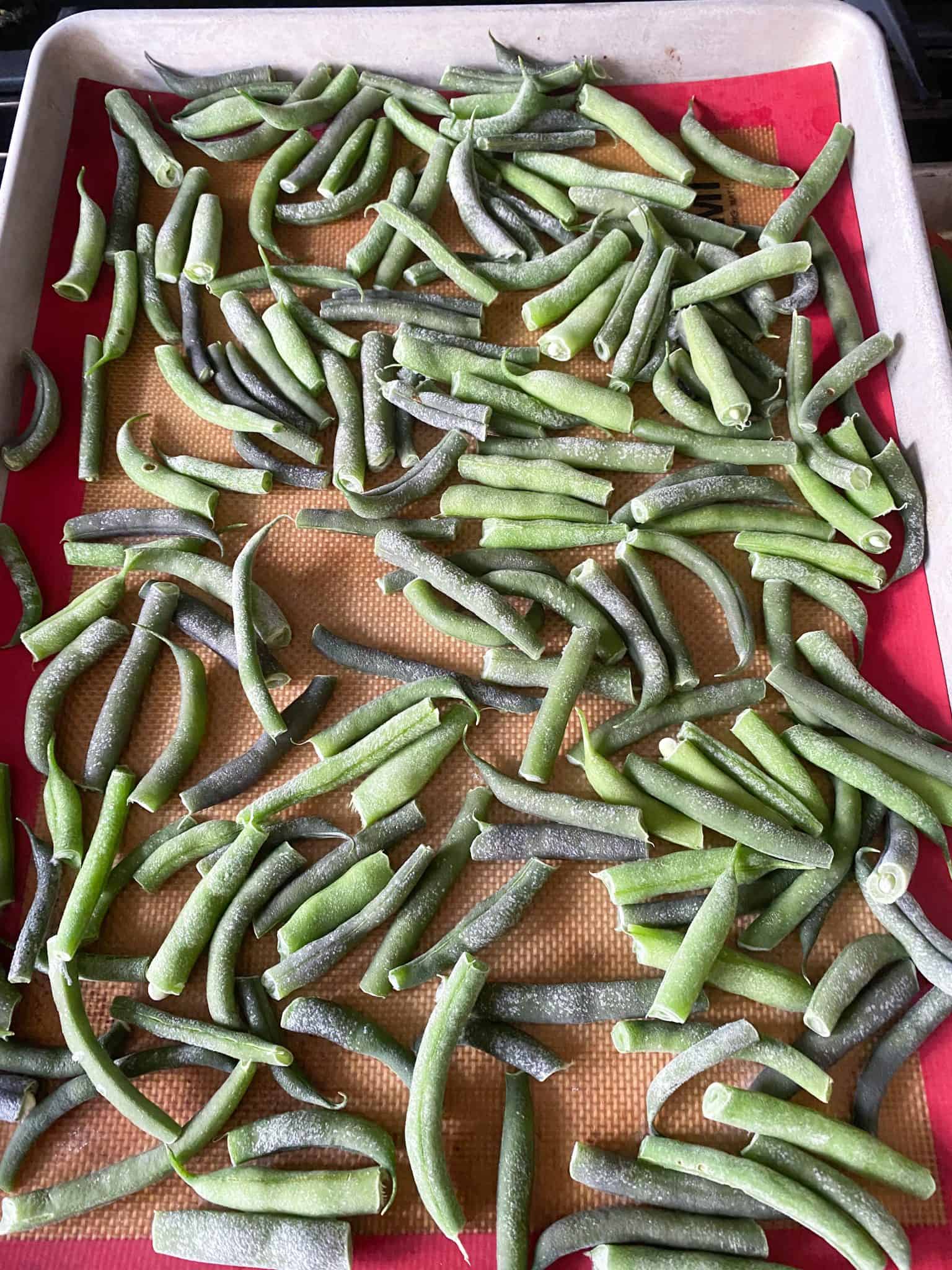 Frozen beans on cookie sheet.