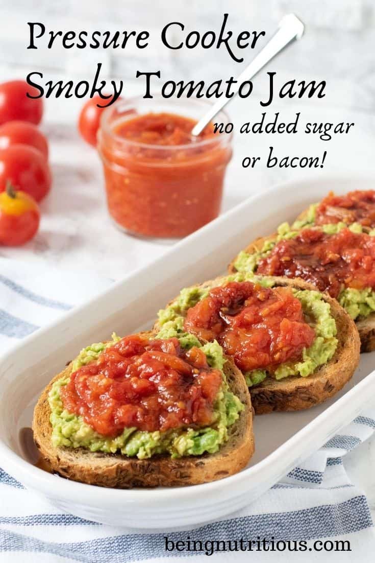 An oval, white dish with 4 round slices of rye bread smeared with avocado, and topped with tomato jam, drizzled with balsamic vinegar. Text overlay: Pressure Cooker Smoky Tomato Jam, no added sugar or bacon.
