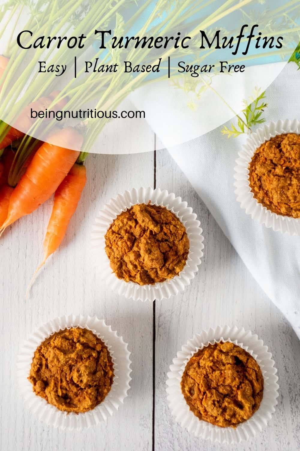 Muffins on a table with fresh carrots. Text overlay: Carrot Turmeric Muffins; easy, whole grain, sugar free.