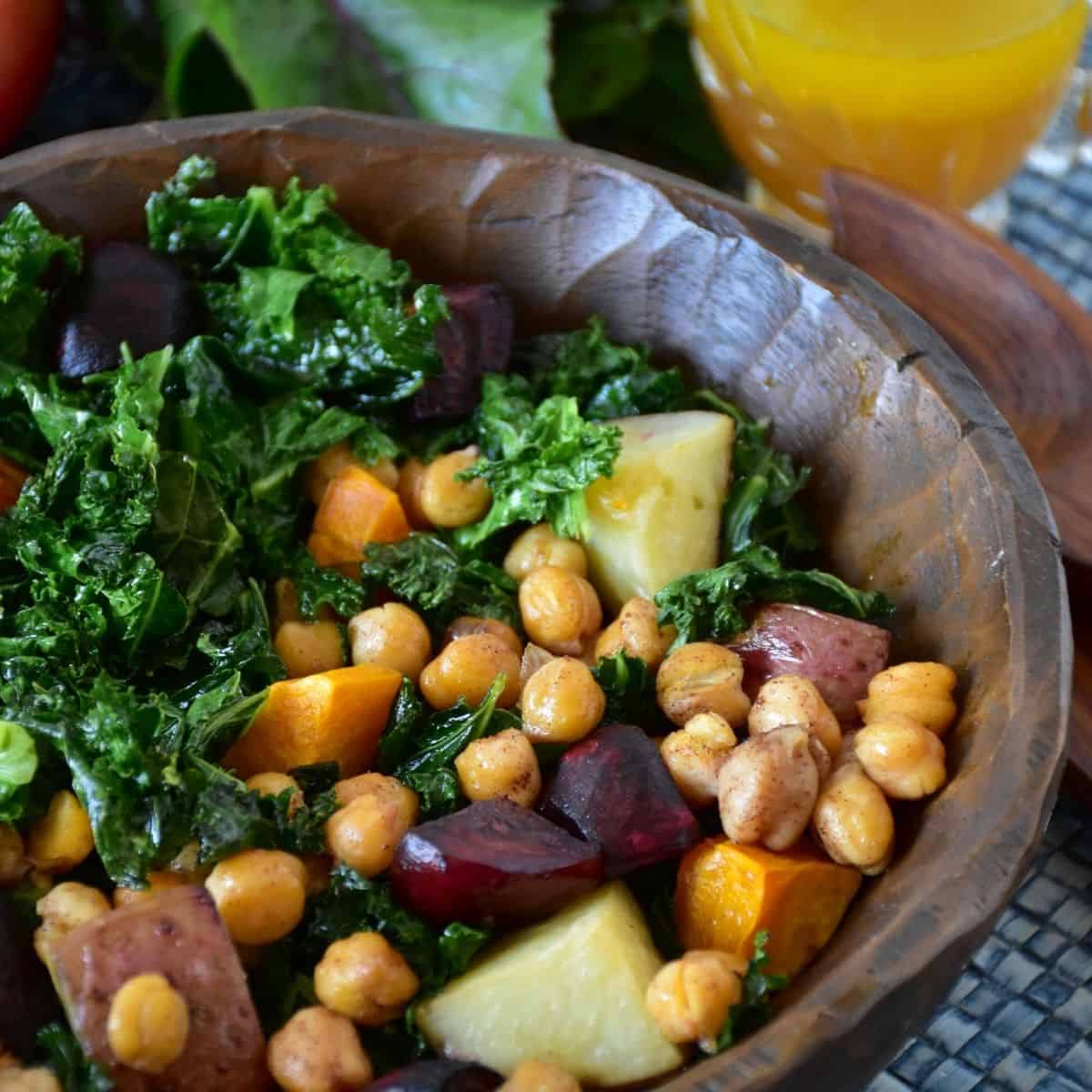 Kale salad in a wooden bowl.