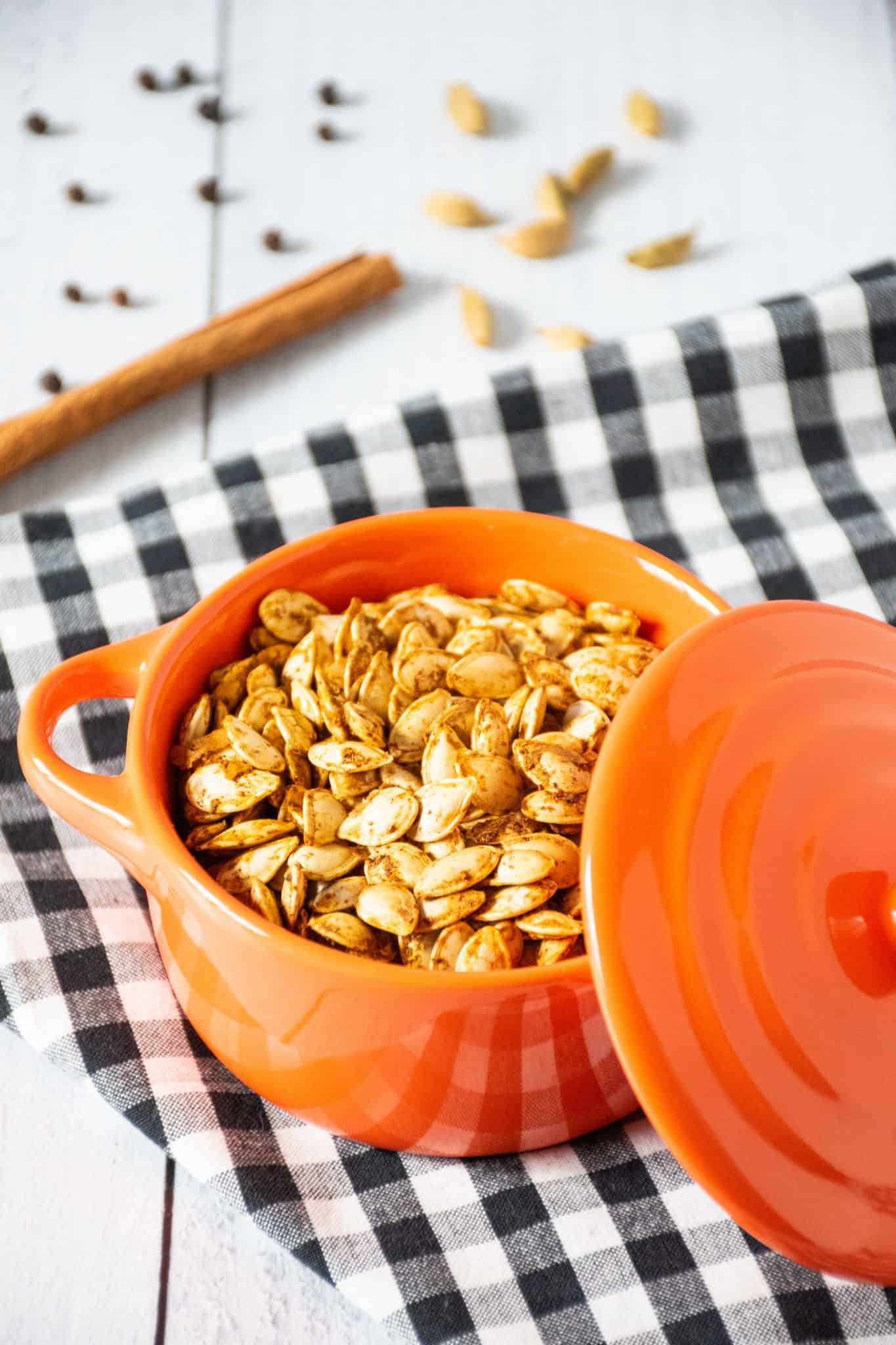 Small ceramic pot of roasted pumpkin seeds