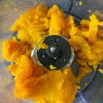 Pumpkin flesh scooped into food processor.
