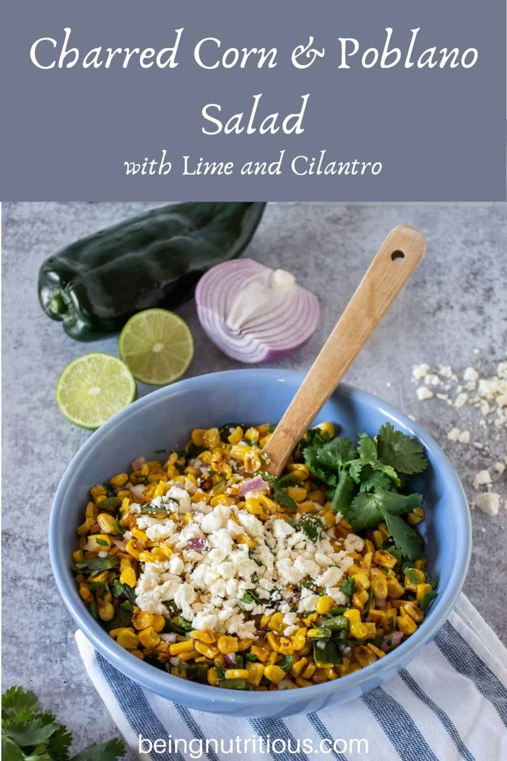 Corn salad in a bowl. Text overlay: Charred Corn & Poblano Salad with Lime and Cilantro.
