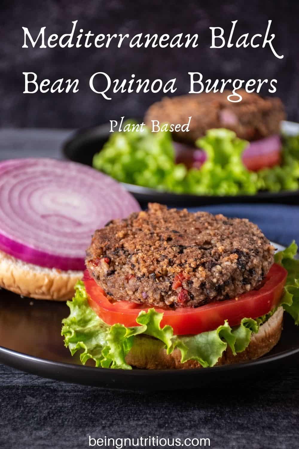 Bean burger on an open bun, with onions, tomatoes, and lettuce. Text overlay: Mediterranean Black Bean Quinoa Burgers; Plant Based.