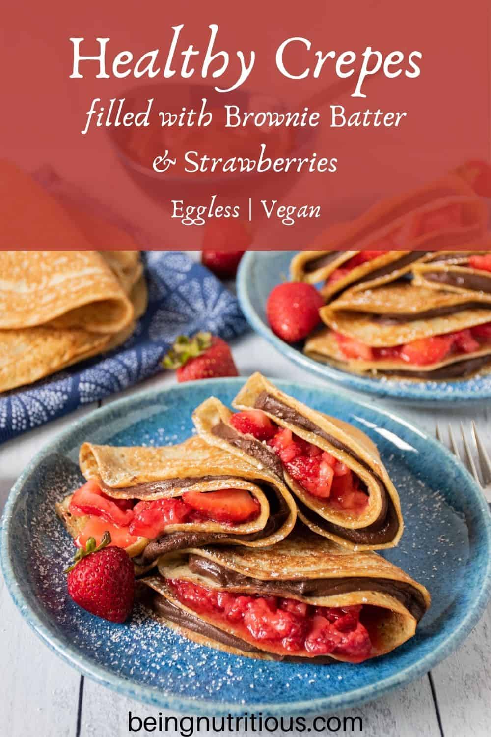 Plate of 3 crepes stuffed with chocolate dip and strawberries. Text overlay: Healthy Crepes filled with Brownie Batter and strawberries; Eggless, Vegan