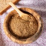 Small wooden bowl filled with breadcrumbs.