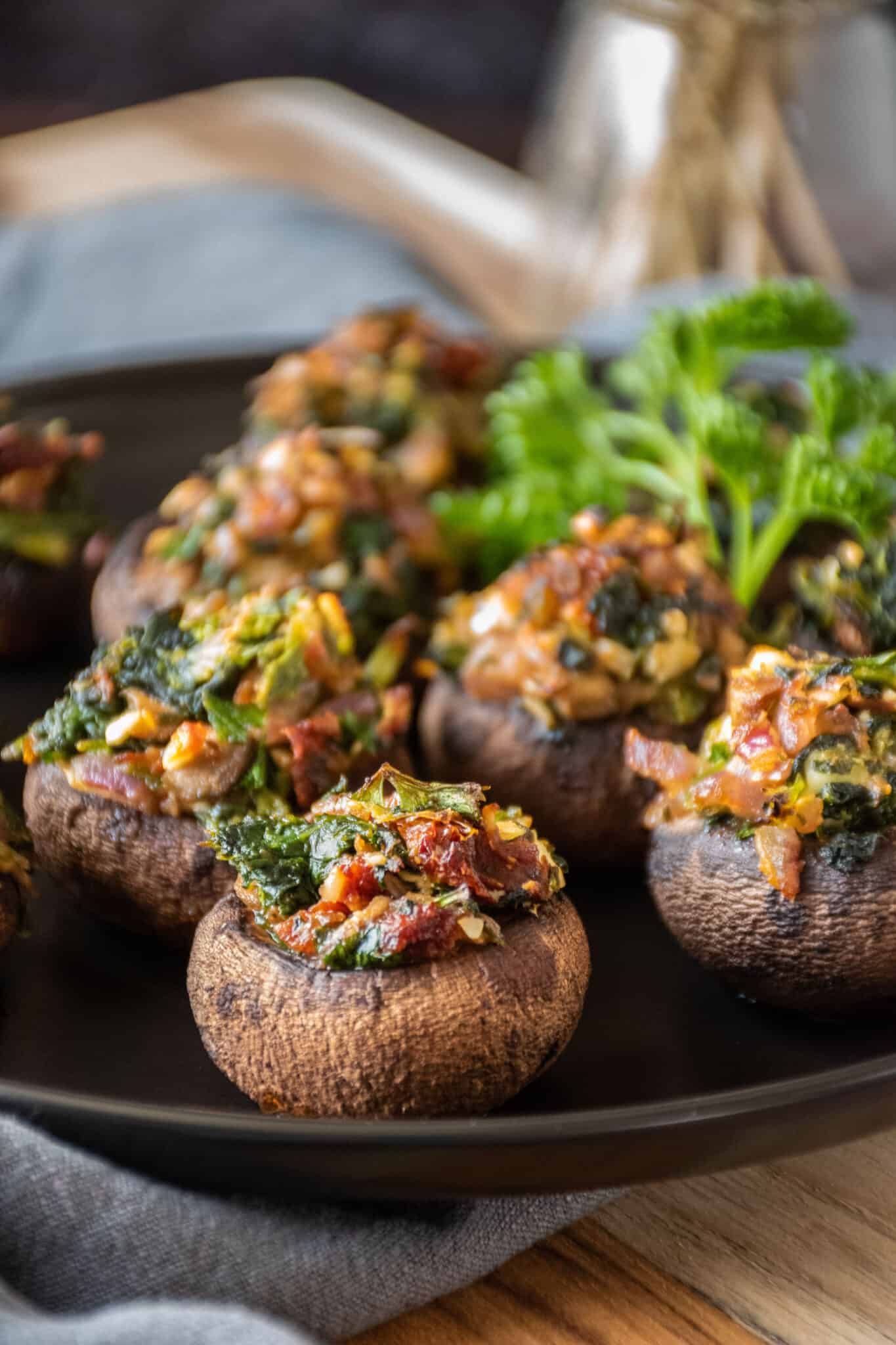 Close up of spinach and feta stuffed mushroom on a plate