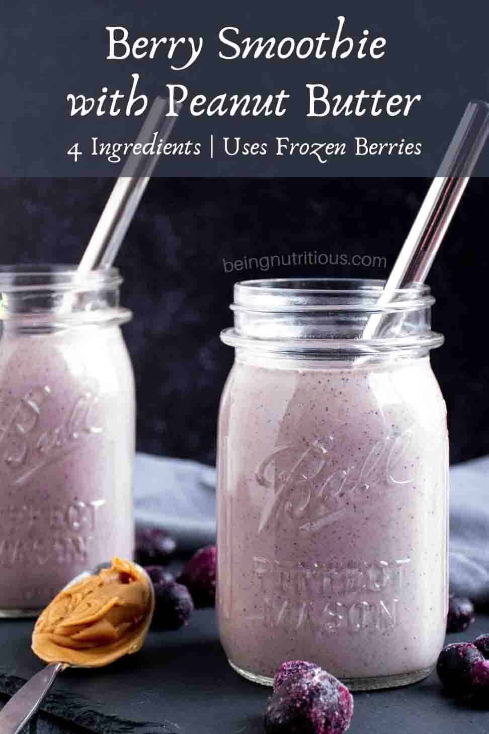 Smoothie in a mason jar, with frozen berries scattered around the outside, and a spoon with peanut butter on it. Text overlay: Berry Smoothie with Peanut Butter; 4 ingredients, uses frozen berries.
