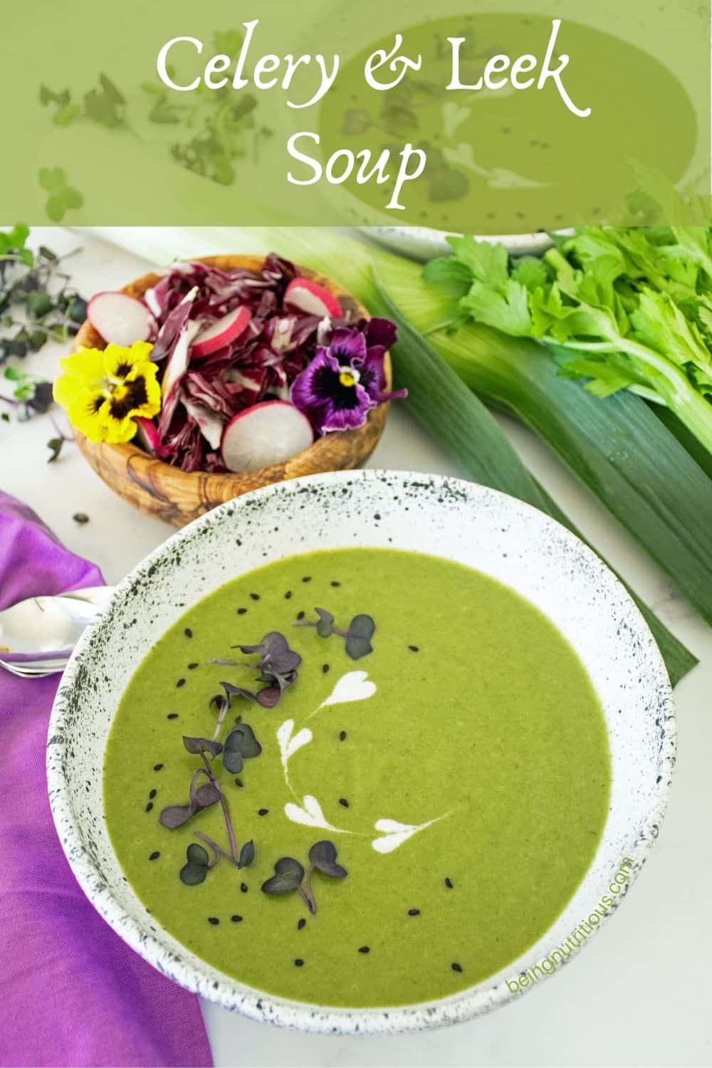 A bowl of soup, garnished with microgreens, black sesame seeds and yogurt. A side salad is in the background. Text overlay: Celery and Leek Soup.