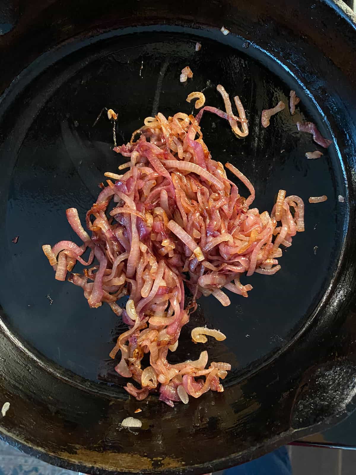 Caramelized red onions in a skillet.