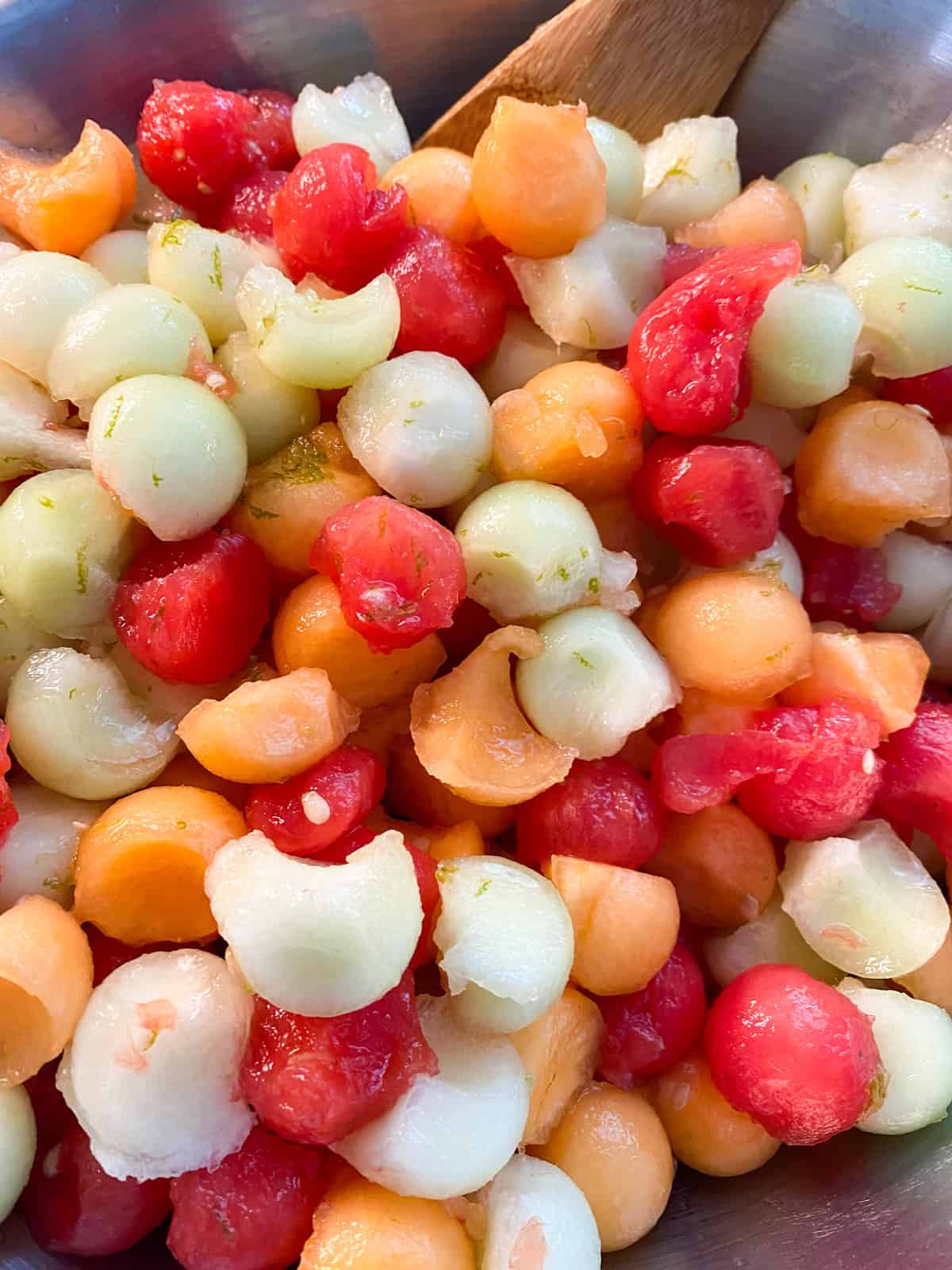 Melon ball salad tossed with the dressing.