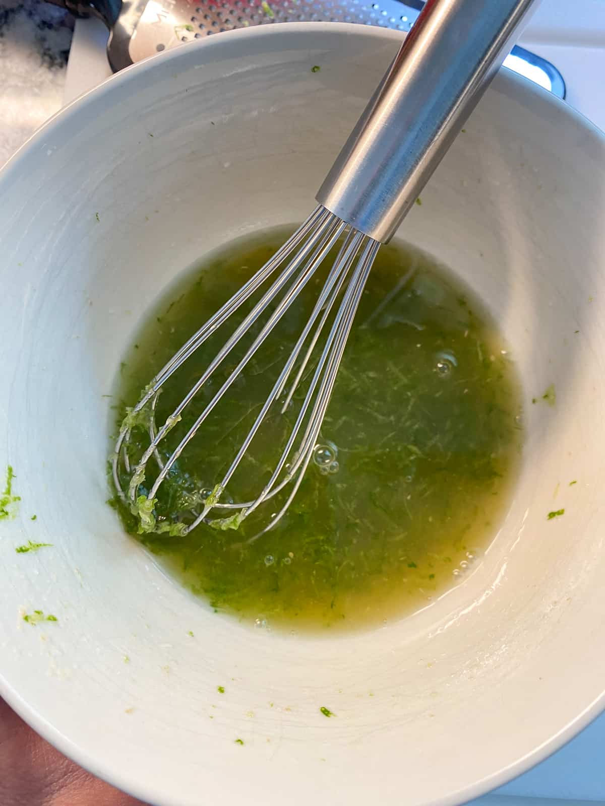 Whisked ginger lime dressing for the melon salad.