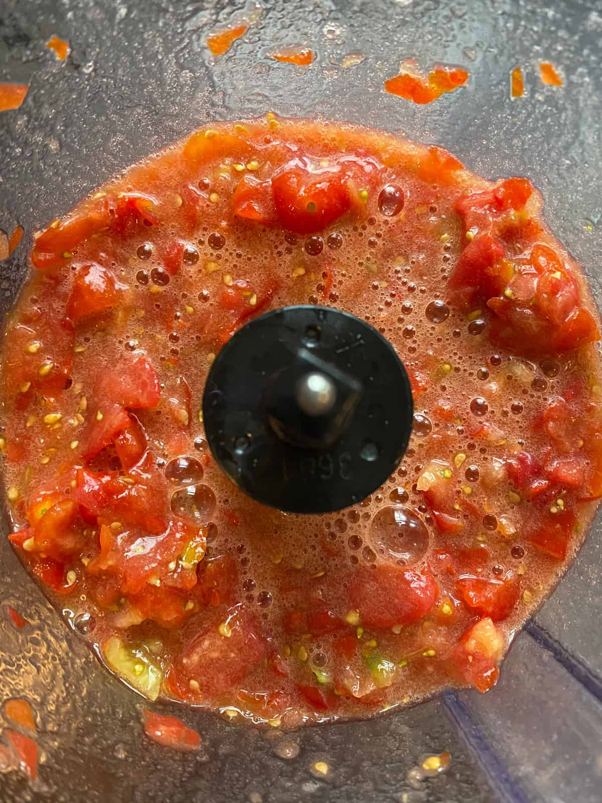 Diced tomatoes from fresh, in a food processor.