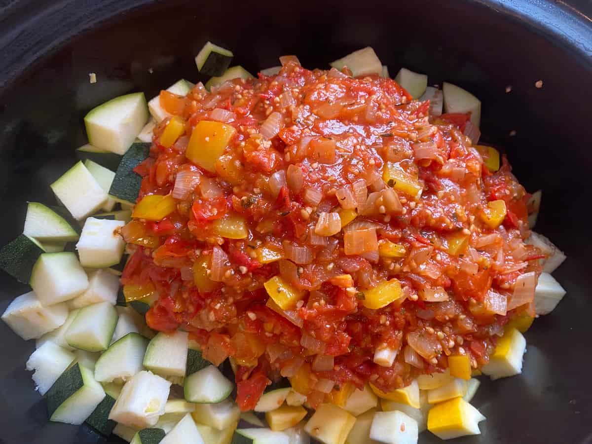 Pour the tomato sauce over the chopped vegetables.