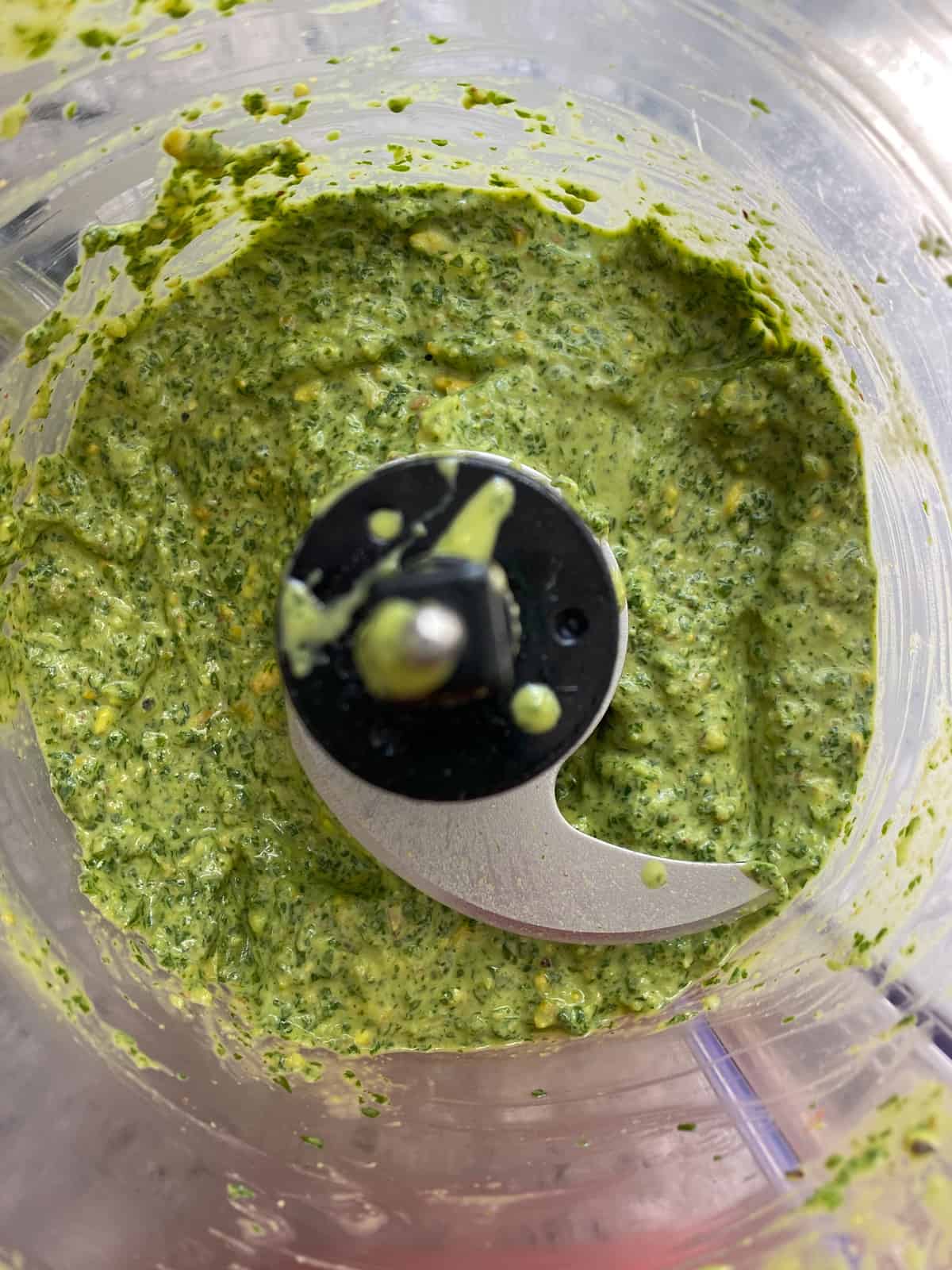 Completely processed pesto in a food processor.