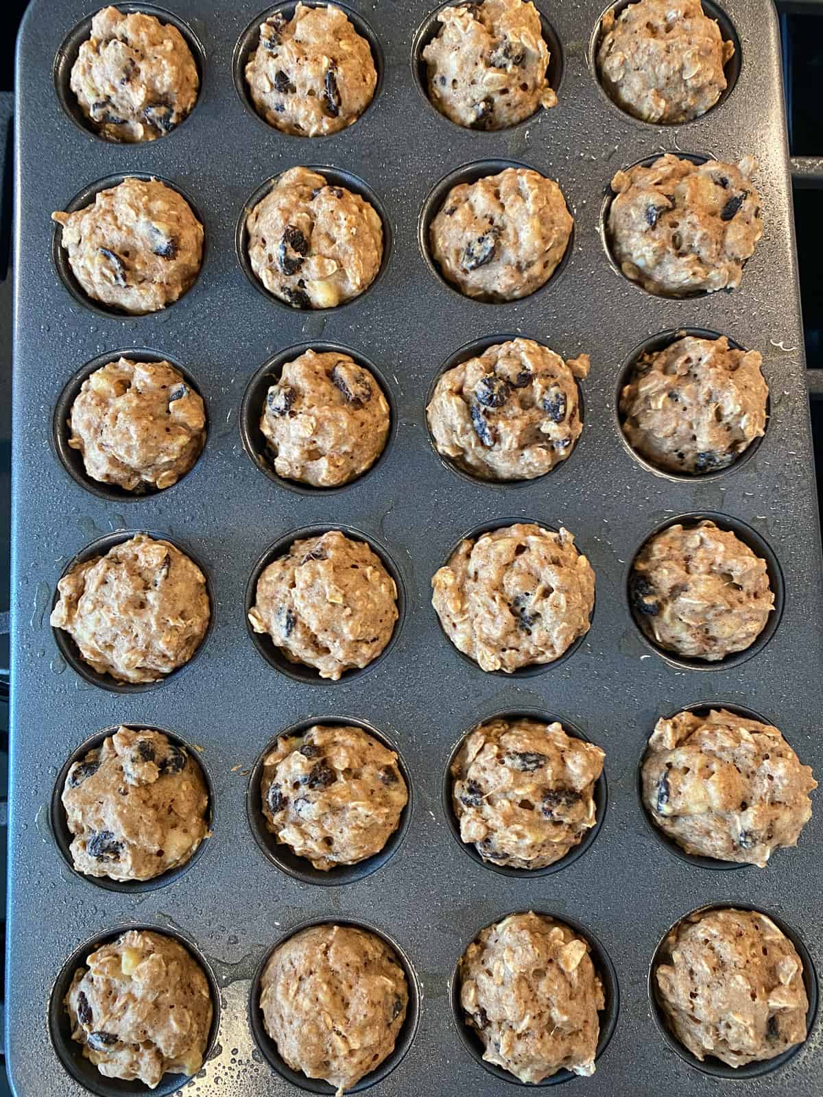 Baked mini muffins in baking tin.