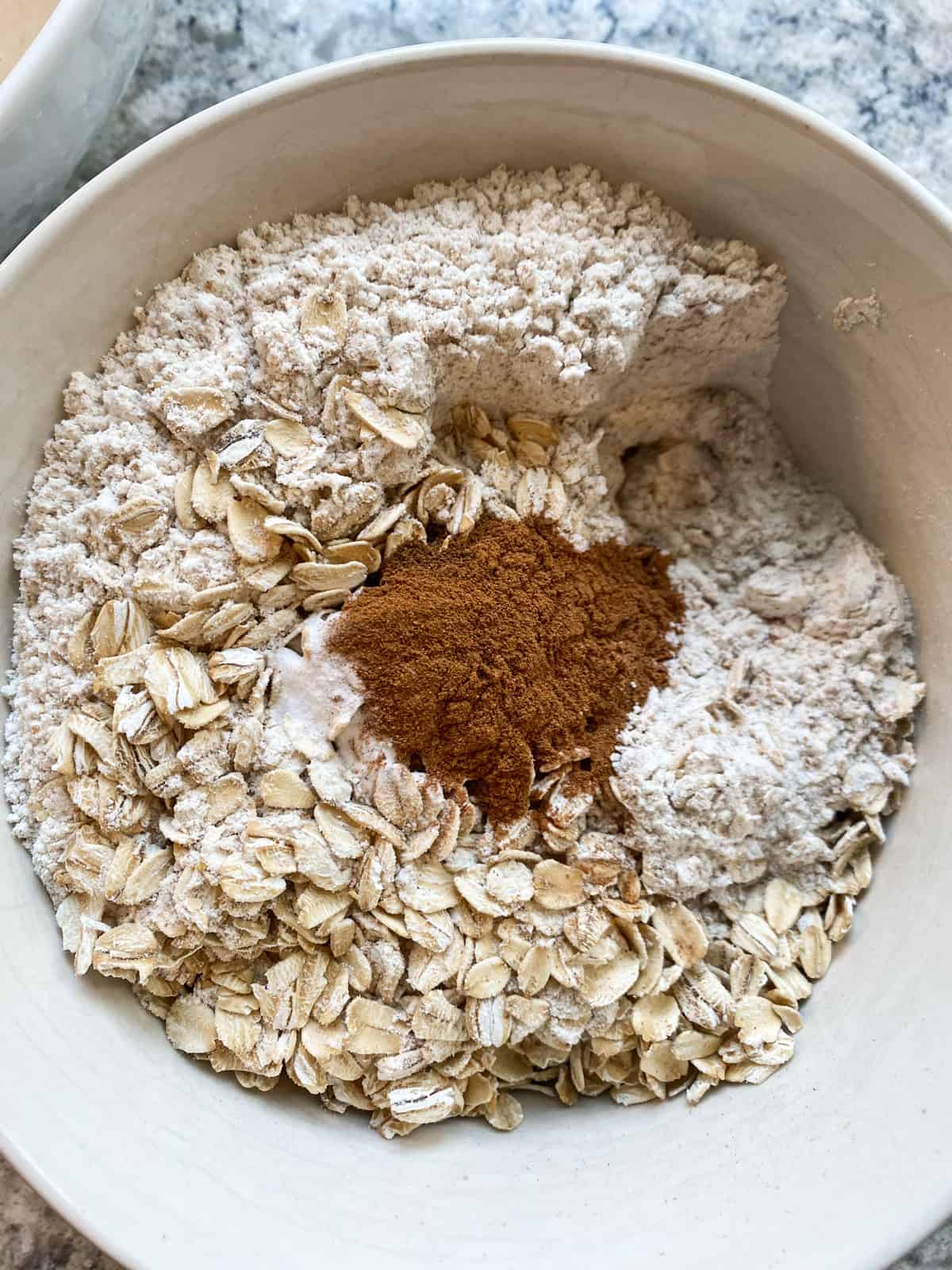 Dry muffin ingredients in a bowl.