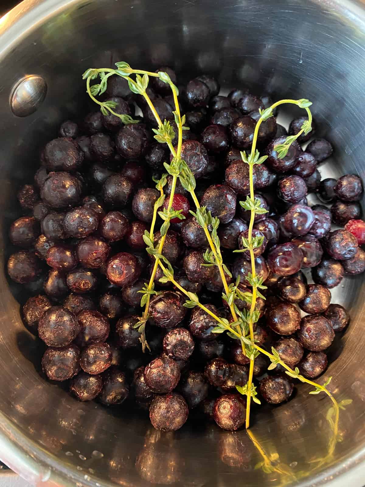 Blueberry jam ingredients in a small saucepan.