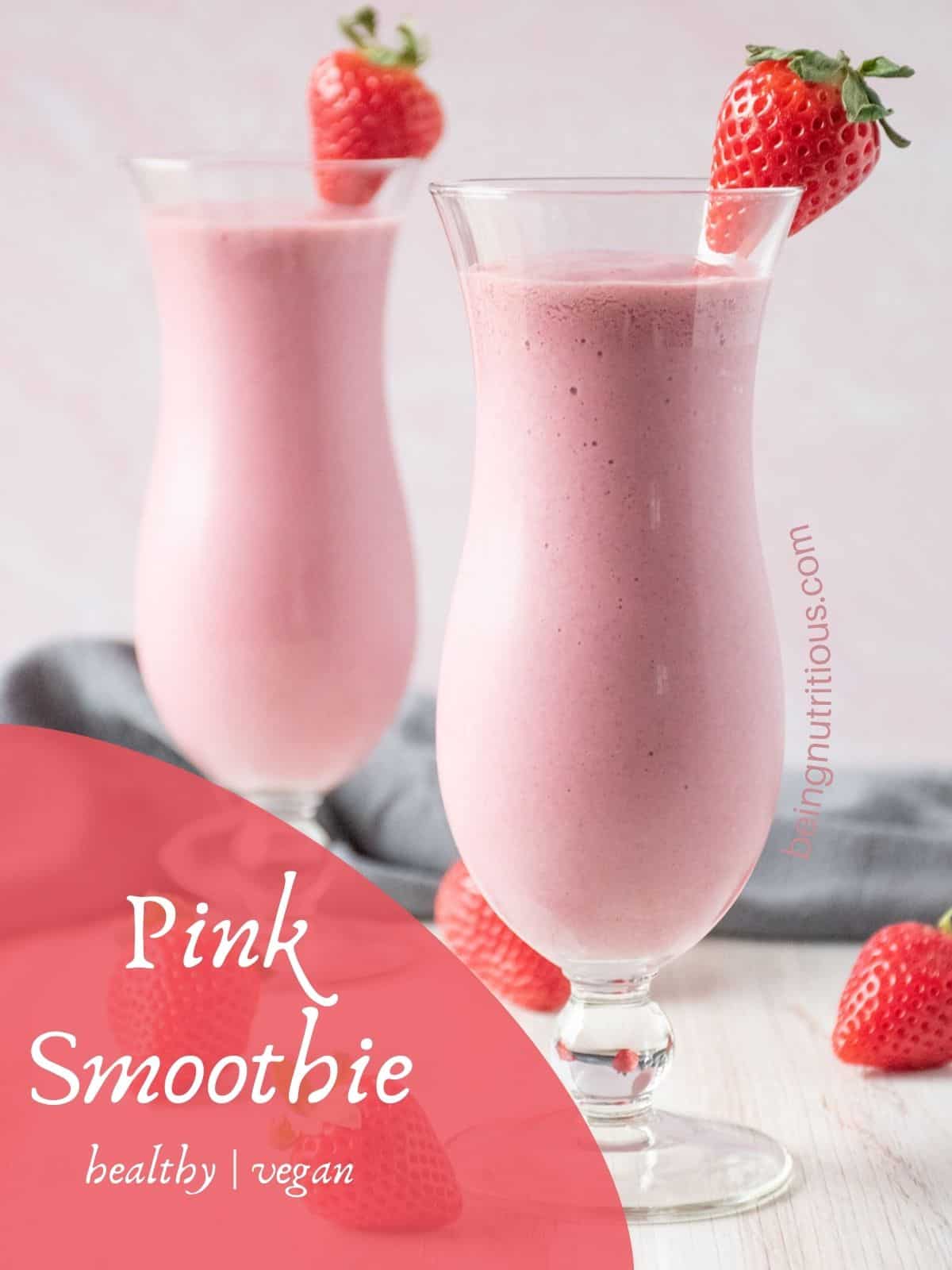Two glasses of a smoothie, garnished with a fresh strawberry. Text overlay: Pink Smoothie; healthy, vegan.
