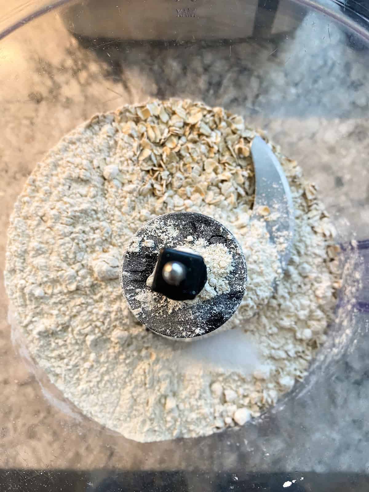 Oats and flour in a food processor.