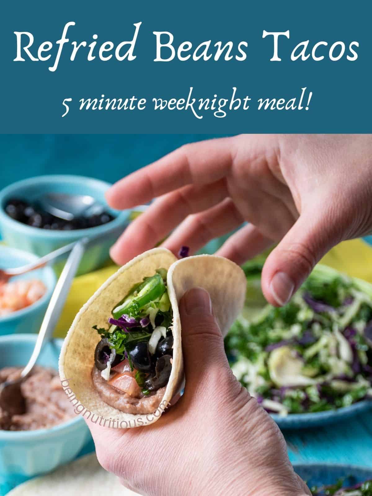 Two hands holding a taco. Text overlay: Refried Beans Tacos; 5 minute weeknight meal.