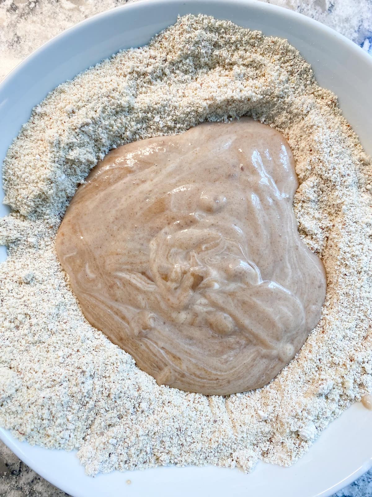 Wet ingredients poured into the dry ingredients.