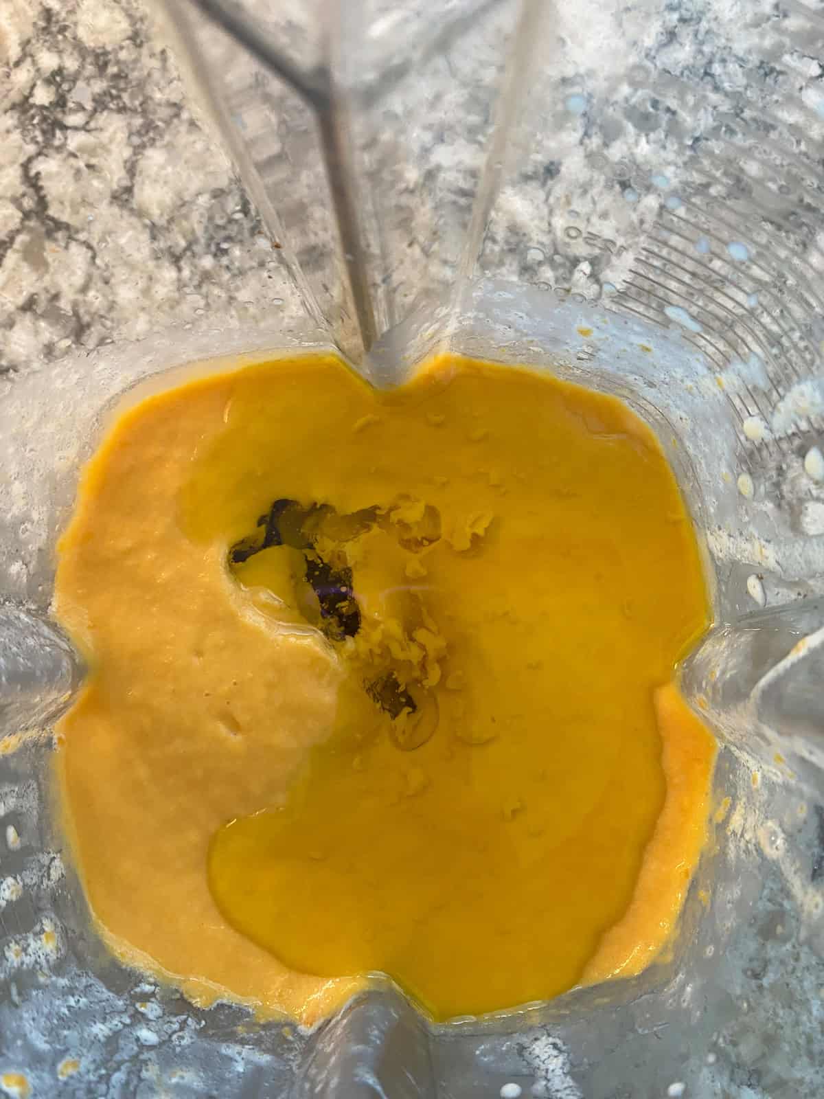 Oil added to blended sweet potato and milk.