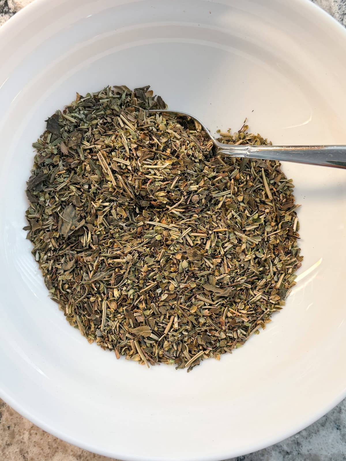All the herbs mixed together in a bowl.