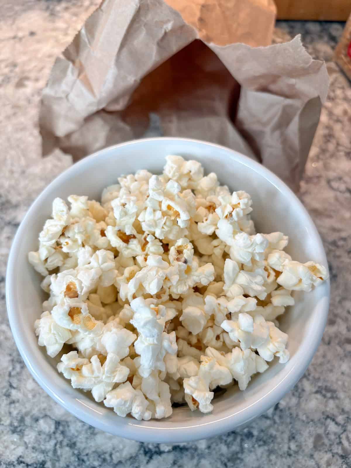 Microwaved popcorn in a bowl.