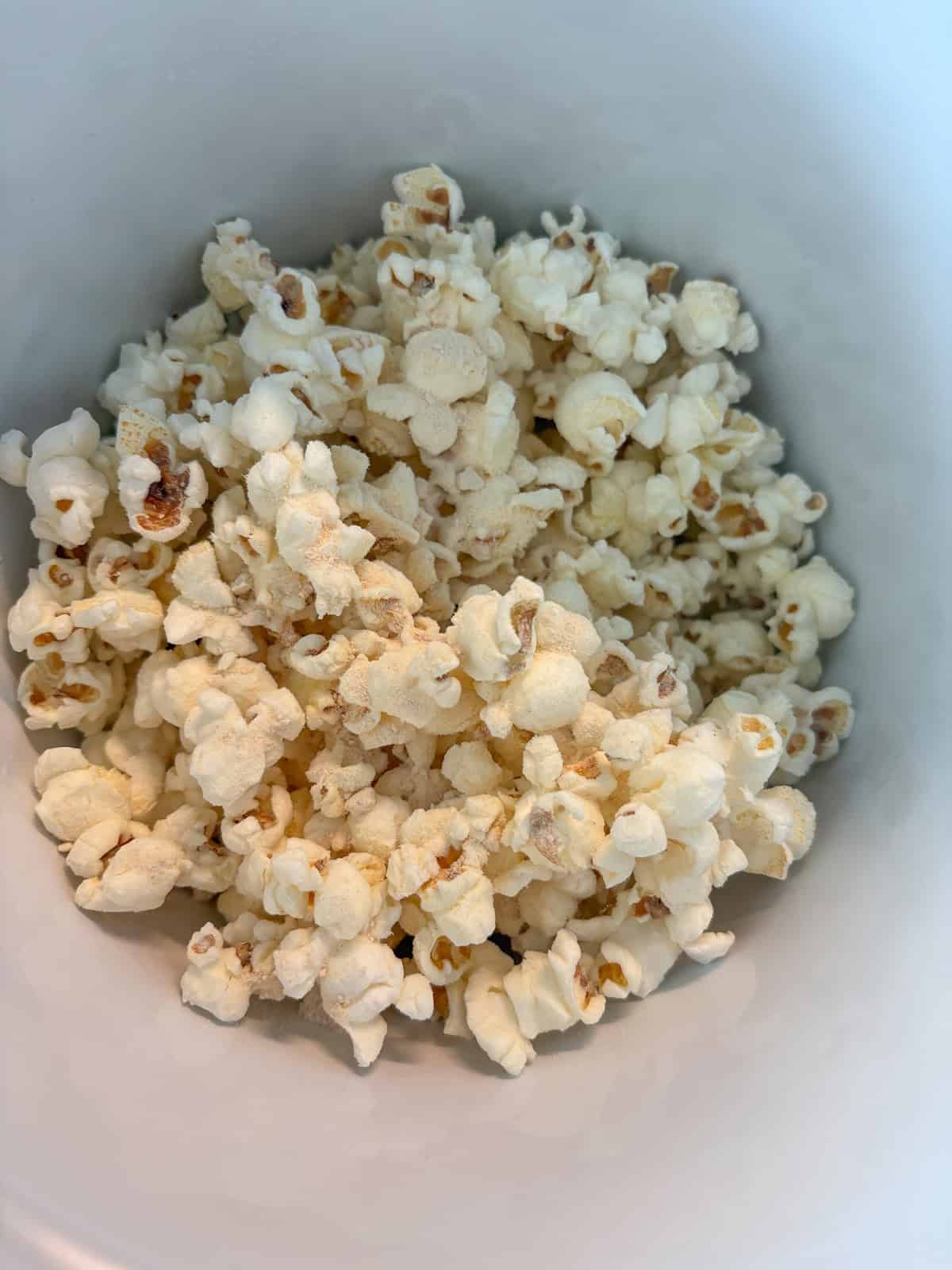 Seasoning added to popcorn.