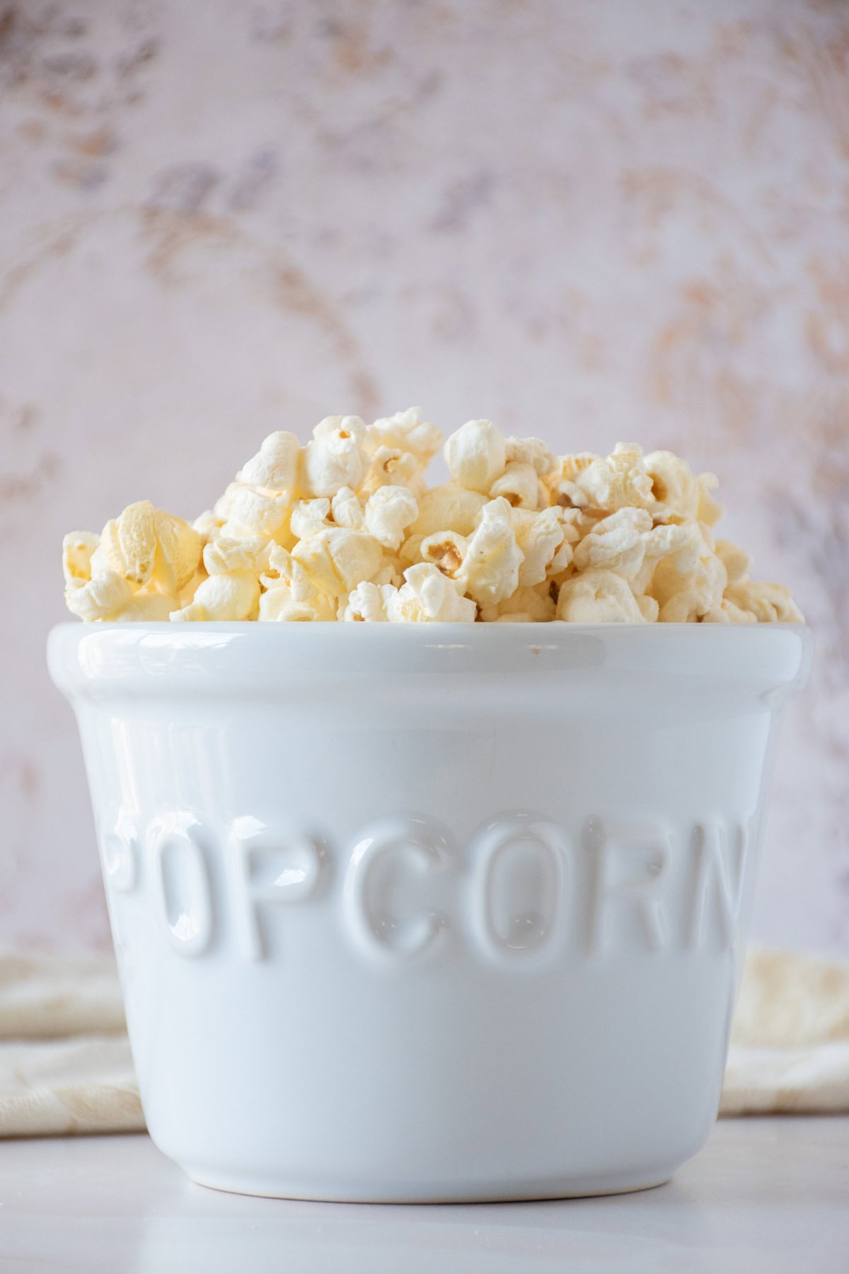 Ceramic bowl of popcorn.
