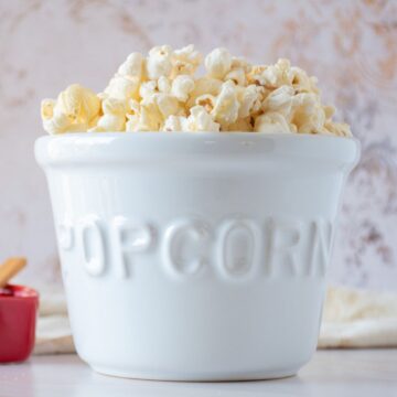 Ceramic bowl of popcorn.