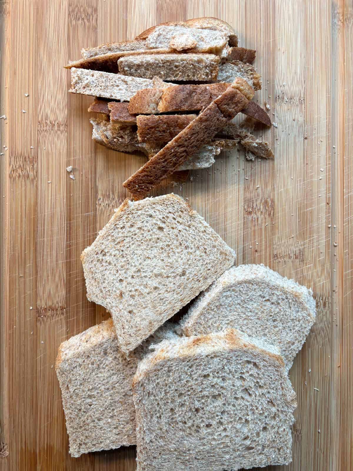 Crust cut off of 4 slices of bread.