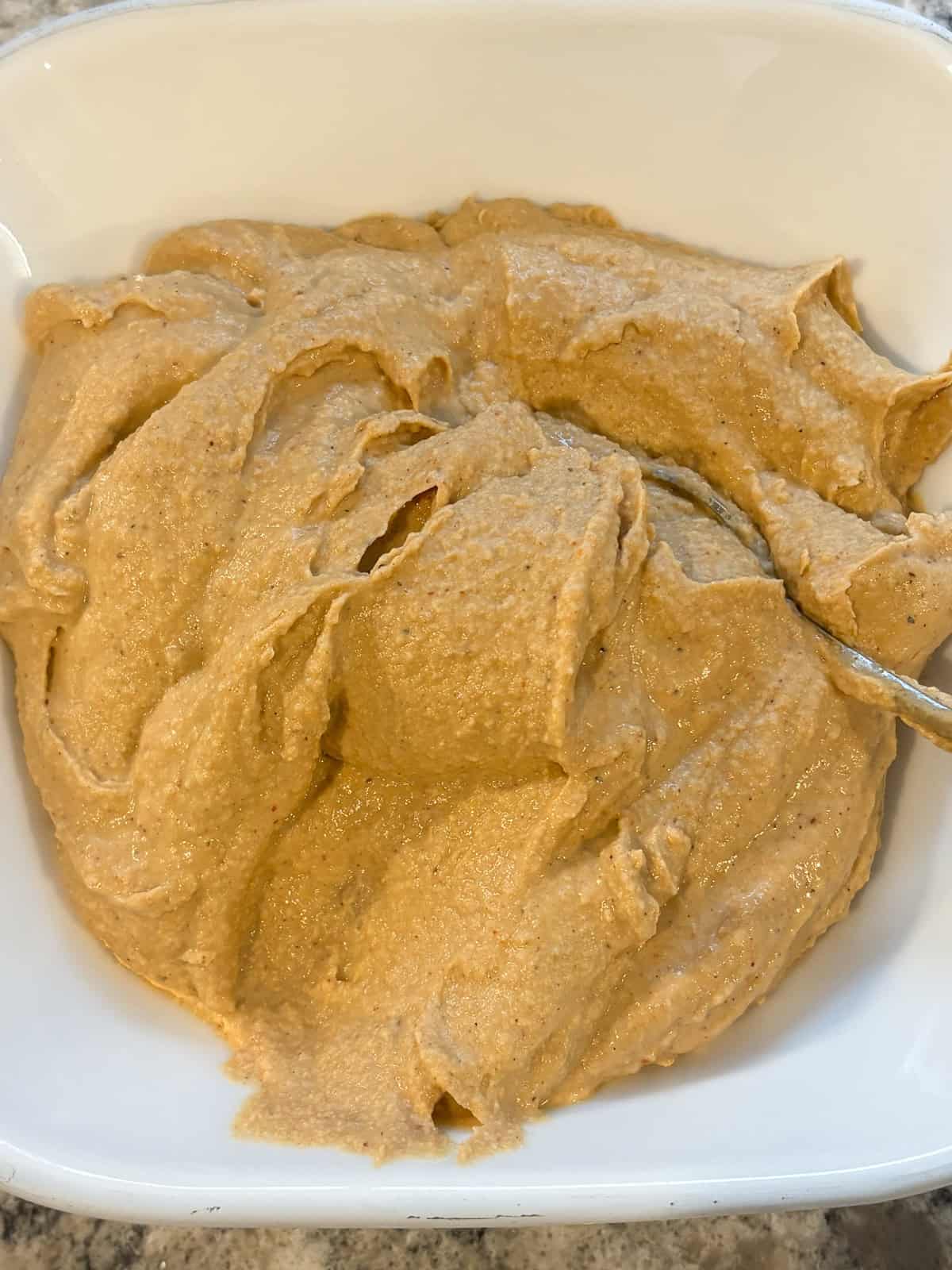 Finished hummus, in a bowl.