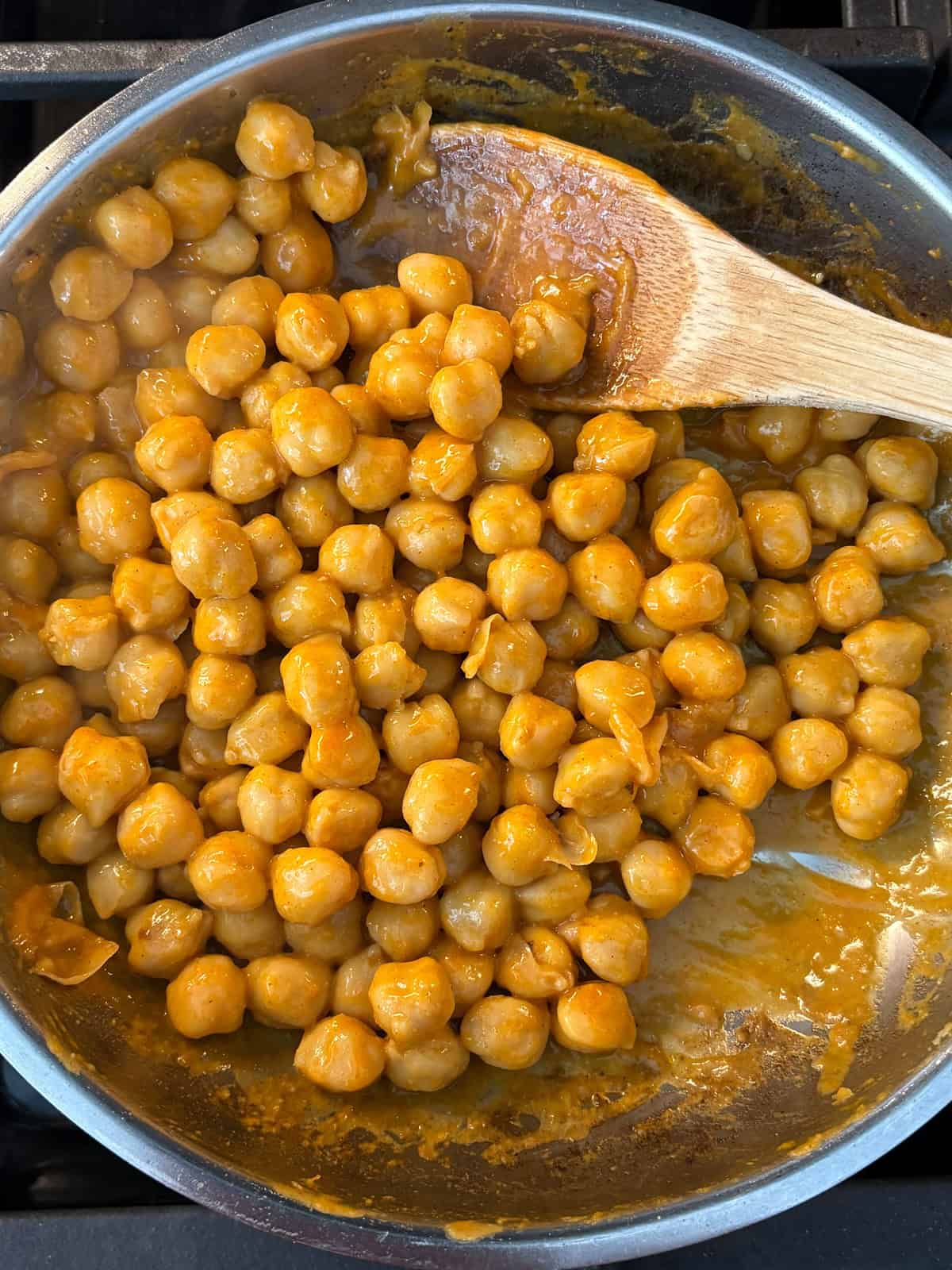 Buffalo sauce mixed into sautéed chickpeas.