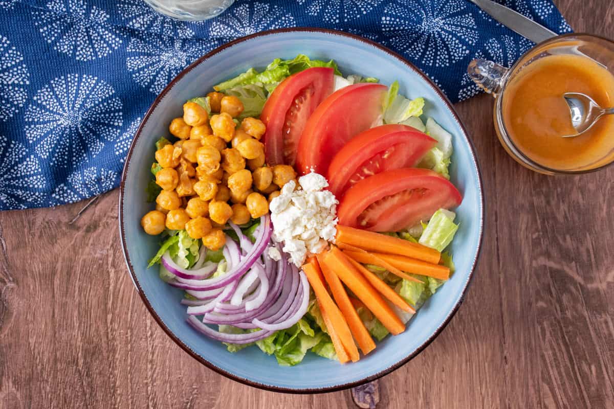 Overhead shot of a bowl of salad before being dressed.